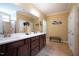 Bathroom with double sinks, and generous counter space with tile flooring at 740 Blackfriars Loop, Cary, NC 27519