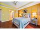 Cozy bedroom featuring hardwood floors and neutral decor with ensuite bath at 740 Blackfriars Loop, Cary, NC 27519