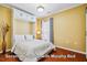 Cozy bedroom featuring a convenient Murphy bed and ample natural light at 740 Blackfriars Loop, Cary, NC 27519