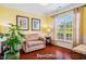 Cozy den featuring hardwood floors, natural light, and an accent chair at 740 Blackfriars Loop, Cary, NC 27519