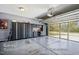 Spacious garage with a custom screen door and sleek cabinet system for storage at 740 Blackfriars Loop, Cary, NC 27519