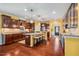 Spacious kitchen featuring a large island, stainless steel appliances, and hardwood floors at 740 Blackfriars Loop, Cary, NC 27519
