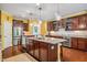 Gourmet kitchen island featuring granite countertops, a wine cooler, and stainless steel appliances at 740 Blackfriars Loop, Cary, NC 27519