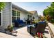 Charming outdoor patio featuring comfortable seating, a grill, and lovely garden views at 740 Blackfriars Loop, Cary, NC 27519