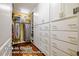Spacious walk-in closet features custom built-ins for optimal storage and organization at 740 Blackfriars Loop, Cary, NC 27519