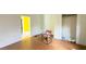 Empty bedroom with hardwood floors, damaged walls and an open closet at 752 Nashville Rd, Rocky Mount, NC 27803