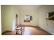 Bright empty bedroom with damaged walls and floors at 752 Nashville Rd, Rocky Mount, NC 27803