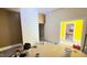 Open living area with bare walls, unpainted and cans of paint at 752 Nashville Rd, Rocky Mount, NC 27803