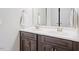 Modern bathroom featuring double sinks, elegant fixtures, and plenty of cabinet space at 852 Cokesbury Park Lane Ln, Fuquay Varina, NC 27526