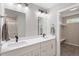 Modern bathroom features a double sink vanity and access to a walk-in closet at 852 Cokesbury Park Lane Ln, Fuquay Varina, NC 27526