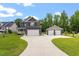 Beautiful home with a spacious driveway leading to an attached two-car garage and a separate two-car garage at 852 Cokesbury Park Lane Ln, Fuquay Varina, NC 27526