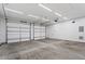 Spacious two car garage with ample lighting and concrete flooring at 852 Cokesbury Park Lane Ln, Fuquay Varina, NC 27526