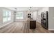 Beautiful kitchen featuring a center island, stainless steel appliances, and modern lighting at 852 Cokesbury Park Lane Ln, Fuquay Varina, NC 27526