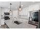 Modern kitchen with stainless steel appliances, granite countertops, and white subway tile backsplash at 852 Cokesbury Park Lane Ln, Fuquay Varina, NC 27526