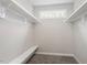 Spacious walk-in closet featuring built-in shelving and a window for natural light at 852 Cokesbury Park Lane Ln, Fuquay Varina, NC 27526