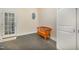 This light-filled entryway features a bench and an oval window, creating a welcoming and bright atmosphere at 8840 Woodyhill Rd, Raleigh, NC 27613