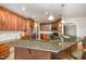 Spacious kitchen with granite countertops and stainless steel appliances at 8840 Woodyhill Rd, Raleigh, NC 27613