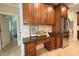 Kitchen nook with granite countertops and natural wood cabinets at 8840 Woodyhill Rd, Raleigh, NC 27613