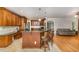 Open kitchen layout with bar seating and seamless transition to living area at 8840 Woodyhill Rd, Raleigh, NC 27613