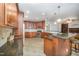 Gourmet kitchen with custom cabinetry and granite countertops at 8840 Woodyhill Rd, Raleigh, NC 27613