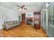 Cozy living room featuring a fireplace, built-in bookshelves, and hardwood floors at 8840 Woodyhill Rd, Raleigh, NC 27613