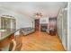 Open-concept living room boasts a fireplace, built-in shelves, hardwood floors, and bright natural light at 8840 Woodyhill Rd, Raleigh, NC 27613