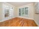 Bright office with hardwood floors, large window, and French doors with transom at 8840 Woodyhill Rd, Raleigh, NC 27613
