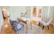 Office features a wooden desk and comfortable seating at 8840 Woodyhill Rd, Raleigh, NC 27613