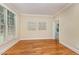 Bright office with hardwood floors, crown molding and large window with view to outside at 8840 Woodyhill Rd, Raleigh, NC 27613