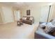 Spacious playroom featuring plush seating and soft, neutral-toned carpeting at 8840 Woodyhill Rd, Raleigh, NC 27613