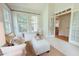 Bright sunroom featuring a seating area and multiple windows for natural light at 8840 Woodyhill Rd, Raleigh, NC 27613