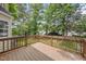 Wood deck surrounded by mature trees for a tranquil outdoor space at 9212 Sayornis Ct, Raleigh, NC 27615