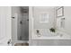 Relaxing bathroom with a separate shower and soaking tub at 9212 Sayornis Ct, Raleigh, NC 27615