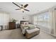 Bright and airy bedroom with natural light, ceiling fan, and a bench at 9212 Sayornis Ct, Raleigh, NC 27615