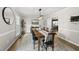 Elegant dining room with hardwood floors, modern lighting, and decorative accents at 9212 Sayornis Ct, Raleigh, NC 27615