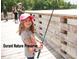 Girl fishing from the pier at the Durant Nature Preserve at 9212 Sayornis Ct, Raleigh, NC 27615