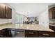 Open kitchen featuring granite countertops and a view of the dining and living areas at 9212 Sayornis Ct, Raleigh, NC 27615