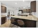 Modern kitchen featuring stainless steel appliances, granite countertops, and a breakfast bar at 9212 Sayornis Ct, Raleigh, NC 27615