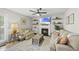 Bright living room with fireplace, neutral walls, recessed lights, and a ceiling fan at 9212 Sayornis Ct, Raleigh, NC 27615