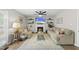 Cozy living room with a fireplace, floating shelves, neutral paint, and a comfortable seating arrangement at 9212 Sayornis Ct, Raleigh, NC 27615