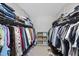 Well-organized walk-in closet with shelving and hanging rods for ample storage at 9212 Sayornis Ct, Raleigh, NC 27615