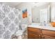 Bathroom with shower with patterned curtain, toilet, and vanity at 100 Stratford Lakes # 130, Durham, NC 27713