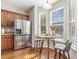 Eat-in kitchen features modern appliances, wooden cabinetry, and a cozy breakfast nook at 100 Stratford Lakes # 130, Durham, NC 27713