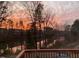 Scenic lake view overlooking the water with a gorgeous sunset at 100 Stratford Lakes # 130, Durham, NC 27713