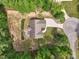 A bird's eye view of the home shows off its sprawling backyard with a charming patio at 105 Old Barn Way, Wendell, NC 27591