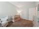 Bedroom featuring a crib, side chair, and dresser, creating a tranquil space at 105 Old Barn Way, Wendell, NC 27591