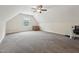 Spacious bonus room with plenty of natural light and carpet, perfect for recreation at 105 Old Barn Way, Wendell, NC 27591