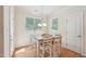 Charming dining area with a modern table set near a bright window at 105 Old Barn Way, Wendell, NC 27591