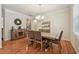 Spacious dining area featuring hardwood floors and modern decor at 105 Old Barn Way, Wendell, NC 27591
