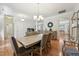 Dining room with hardwood flooring open to other living area at 105 Old Barn Way, Wendell, NC 27591